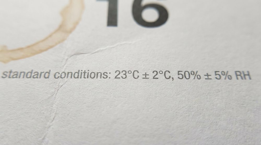 Close-up of a construction chemicals datasheet showing the standard conditions footnote: 23°C ± 2°C, 50% ± 5% RH