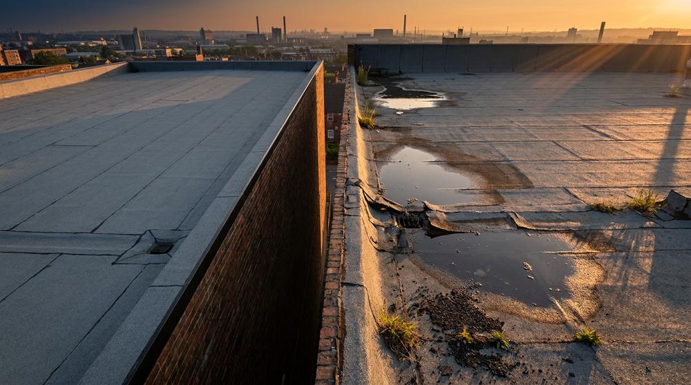 Two flat roofs in contrasting conditions — context for EN 1928 hydrostatic head test limitations on installed assemblies